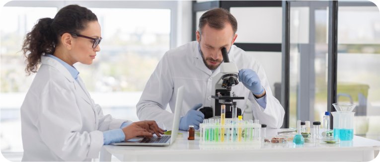 IntroLab scientists observing samples under the microscope for biochemical testing
