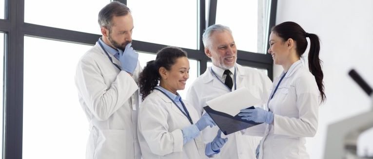 lab technicians talking about the microbiological tests