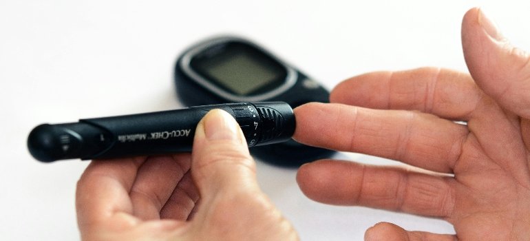 A person measuring their blood sugar levels
