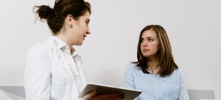 A doctor and a pregnant woman discussing prenatal tests.