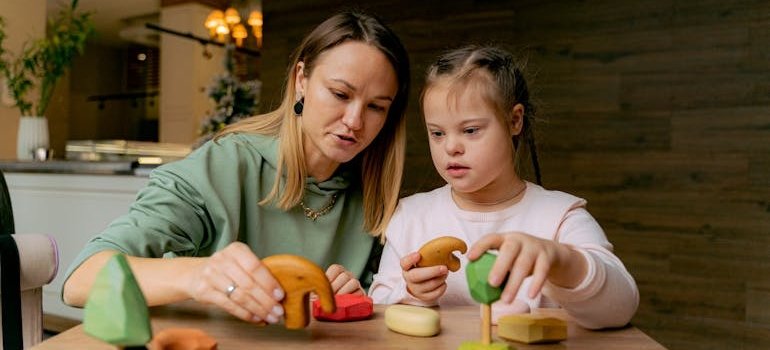 Mother and daughter playing with toys