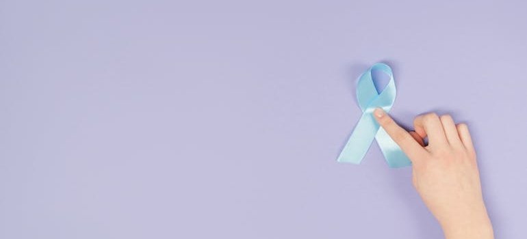 Hand on a Blue Ribbon