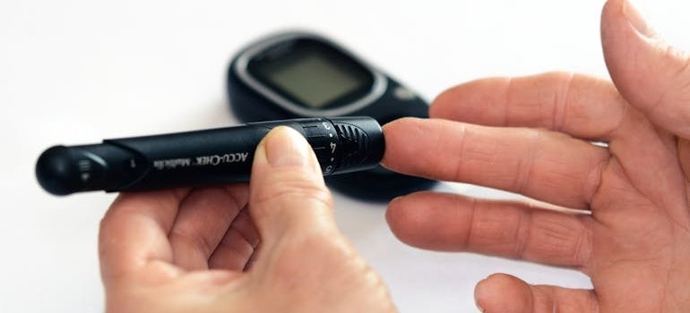 A person measuring their blood sugar level.